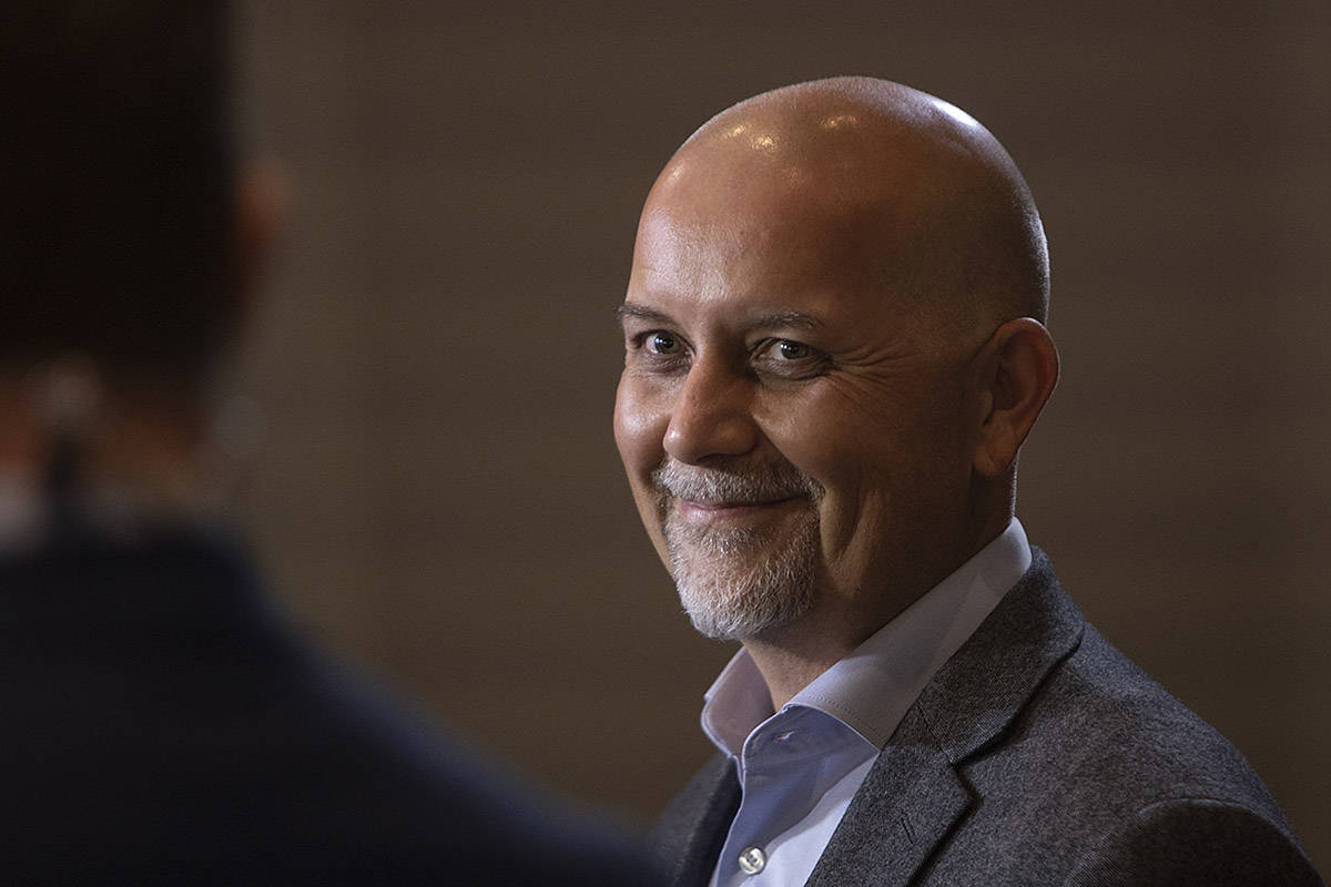 Adam Olson is all smiles after hearing he has retained his seat at Provincial Green Party headquarters at the Delta Victoria Ocean Pointe in Victoria. (Arnold Lim/Black Press)