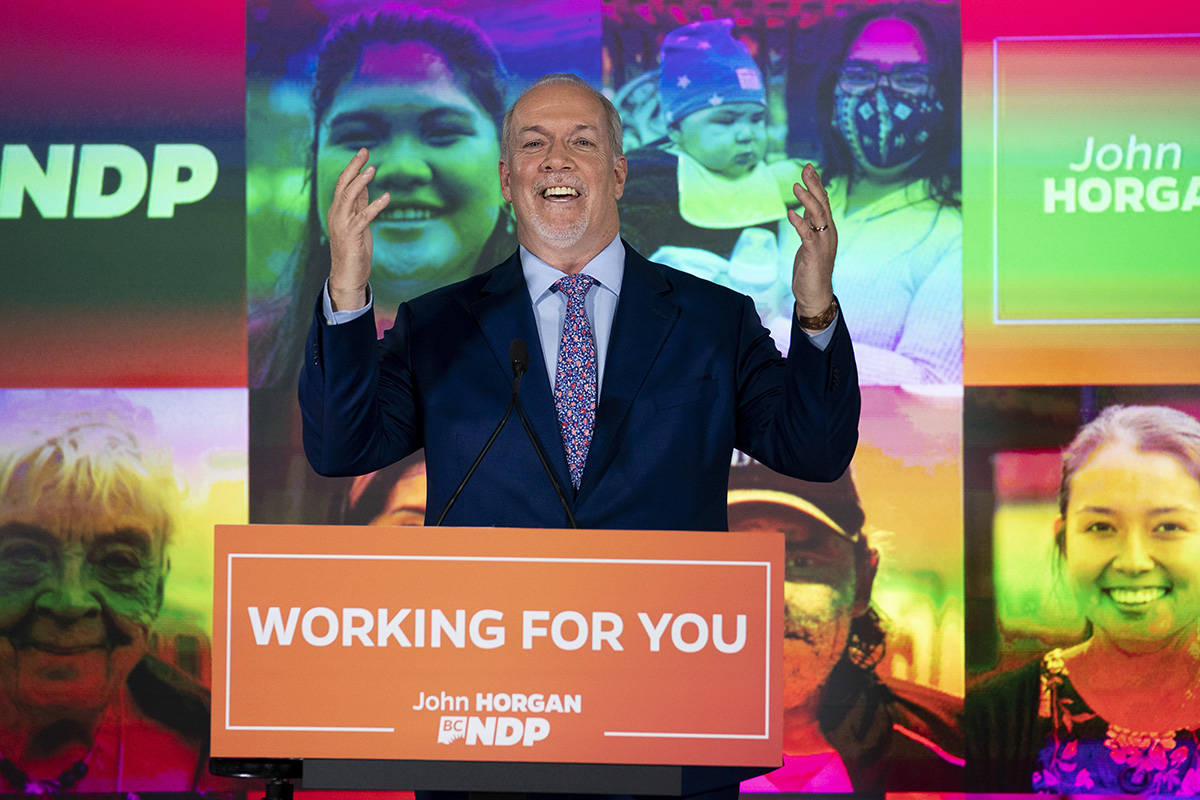 NDP Leader John Horgan celebrates his election win in the British Columbia provincial election in downtown Vancouver, B.C., Saturday, Oct. 24, 2020. THE CANADIAN PRESS/Jonathan Hayward