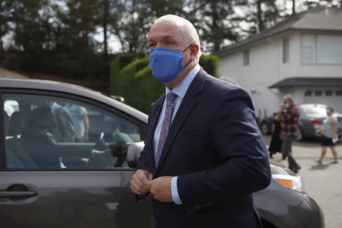 Premier John Horgan heads to his ride following his announcement that there will be a fall election as he speaks during a press conference in Langford in September. (Chad Hipolito/Canadian Press)