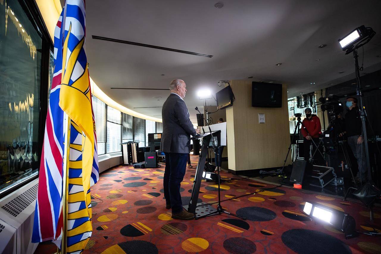 B.C. Premier John Horgan listens during a postelection news conference in Vancouver on Sunday, October 25, 2020. Horgan lost seven ministers who didn’t seek re-election as he looks at putting together a new cabinet following the NDP’s majority election win last week. THE CANADIAN PRESS/Darryl Dyck
