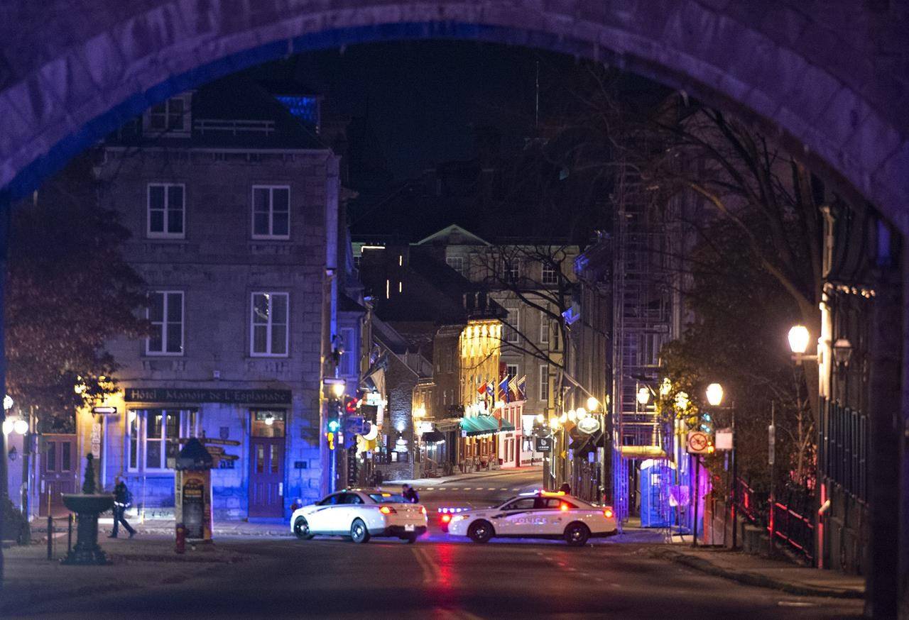 Police cars block the Saint-Louis Street near the Chateau Frontenac, early Sunday, November 1, 2020 in Quebec City. Extra mental health supports are available for those in Quebec’s capital, which was shaken by a deadly sword attack on Halloween night. THE CANADIAN PRESS/Jacques Boissinot