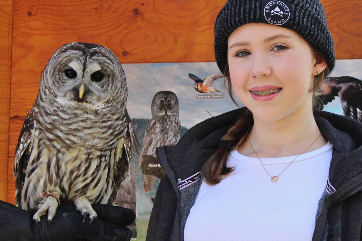 Rozzy Hatch poses with Marlowe, the owl she named. Marlowe is the Mountainaire Avian Rescue Society’s newest owl ambassador. Photo by Jan Smith