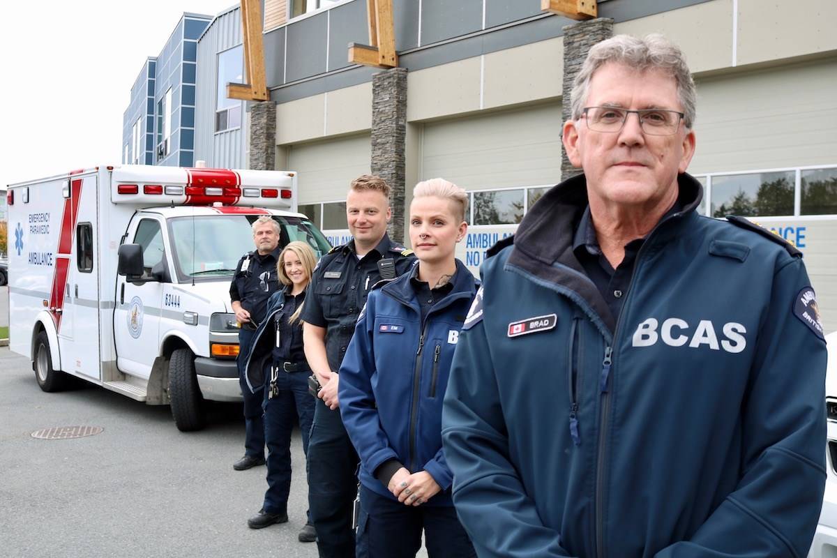 B.C. Ambulance Services’ Island manager Brad Cameron (from right) with primary care paramedics Em Funk, Tyrone Trotter, Fiona Galvin and Peter Hill at their Leigh Road station. (Aaron Guillen/News Staff)