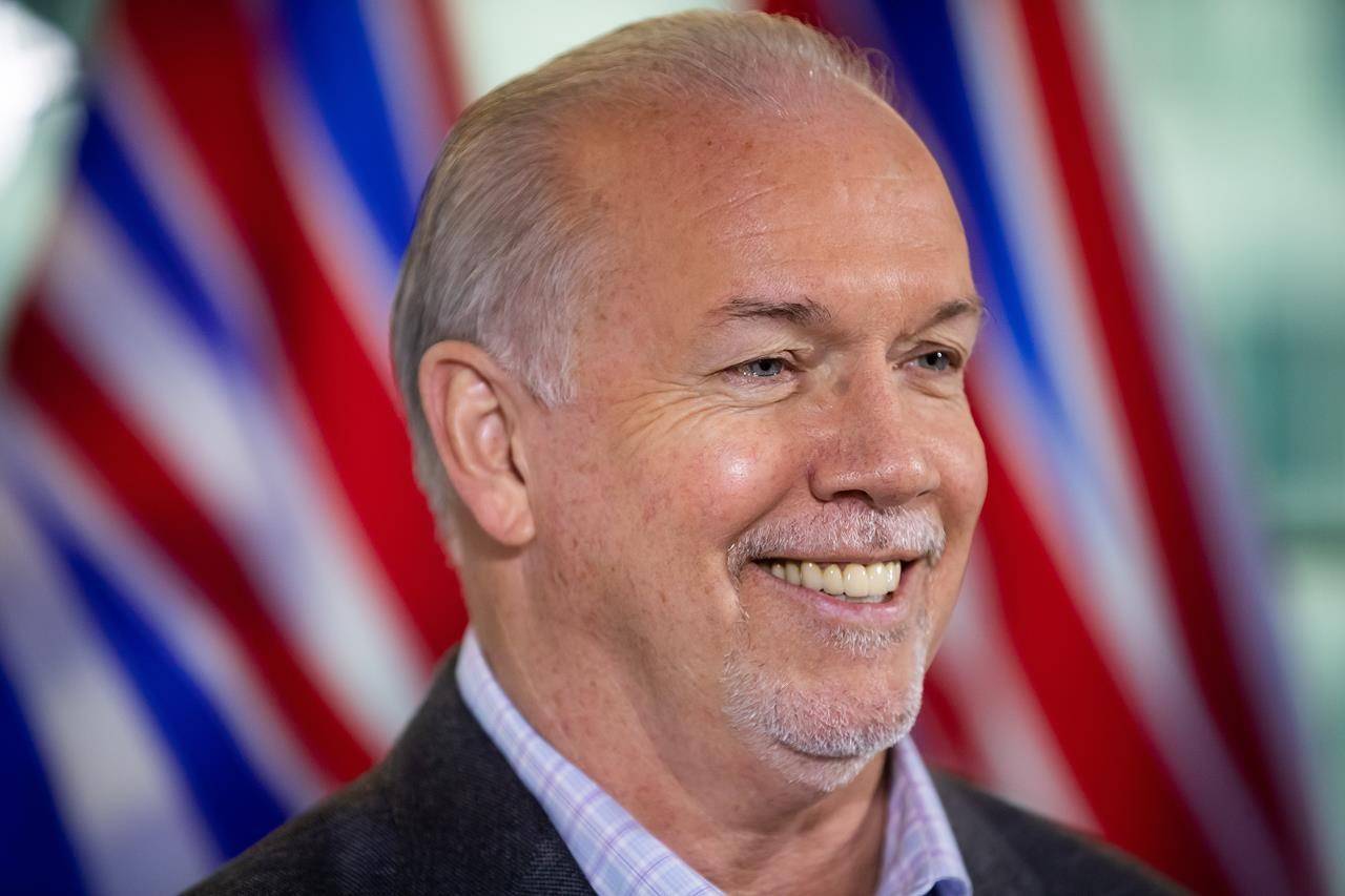 B.C. Premier-elect John Horgan smiles during a post-election news conference, in Vancouver, B.C., Sunday, Oct. 25, 2020. British Columbians could soon know the final results of the provincial election as officials have said they are aiming to wrap up the mail-in ballot count today. THE CANADIAN PRESS/Darryl Dyck