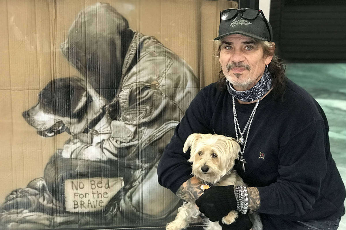 Victoria-based artist Paul Archer poses with one of his striking images of a veteran. Completing such paintings has become a November tradition. (Kendra Crighton/News Staff)
Paul Archer, a Victoria-based artist, tries to paint one Remembrance Day piece each year in November. (Kendra Crighton/News Staff)