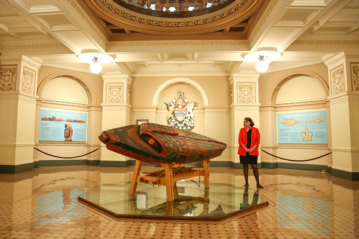 Janet Austin, lieutenant governor of British Columbia stands by a canoe carved by former lieutenant governor Steven Point. The canoe named Shxwtitostel (pronounced: Schwe-tea-tos-tel) means “a safe place to cross the river” in Halq’eméylem and is currently on display at the B.C. Legislature building. (Office of the Lieutenant Governor of British Columbia photo)
