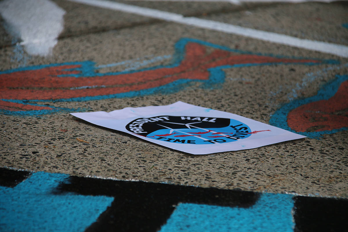 A group of students from Divest UVic held a socially-distanced live-art protest on Wednesday calling for the University of Victoria to divest $400 million in investment funds from the fossil fuel industry. (Kendra Crighton/News Staff)