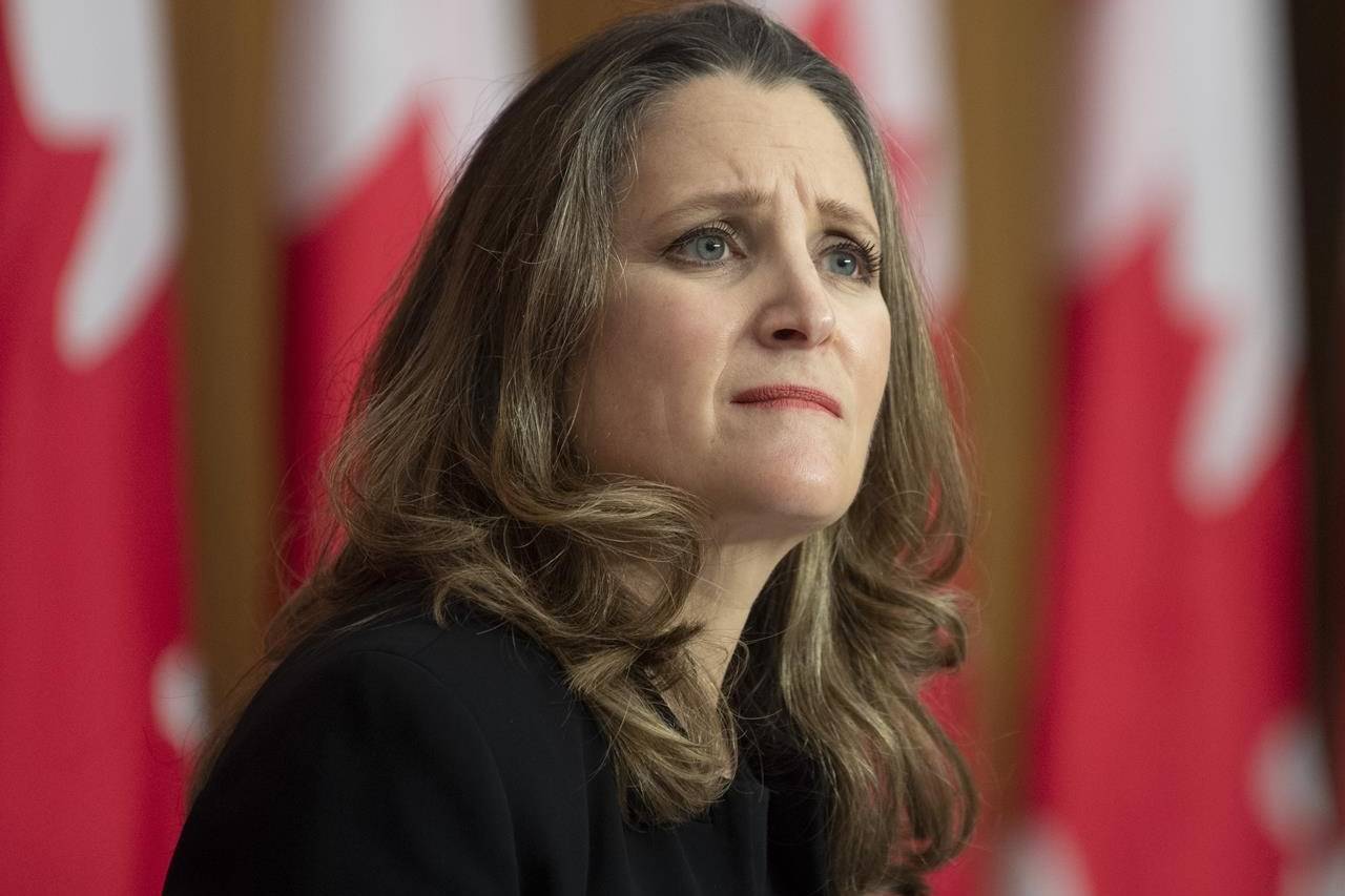 Deputy Prime Minister and Minister of Finance Chrystia Freeland listens to a question from a reporter on the phone during a news conference in Ottawa, Monday, Nov. 30, 2020. THE CANADIAN PRESS/Adrian Wyld