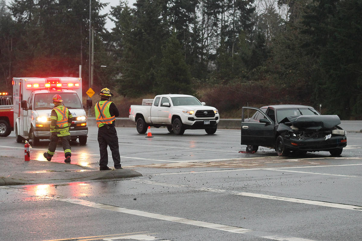 Emergency crews on scene at a crash on the Island Highway at Ware Road on Sunday. (Greg Sakaki/News Bulletin)