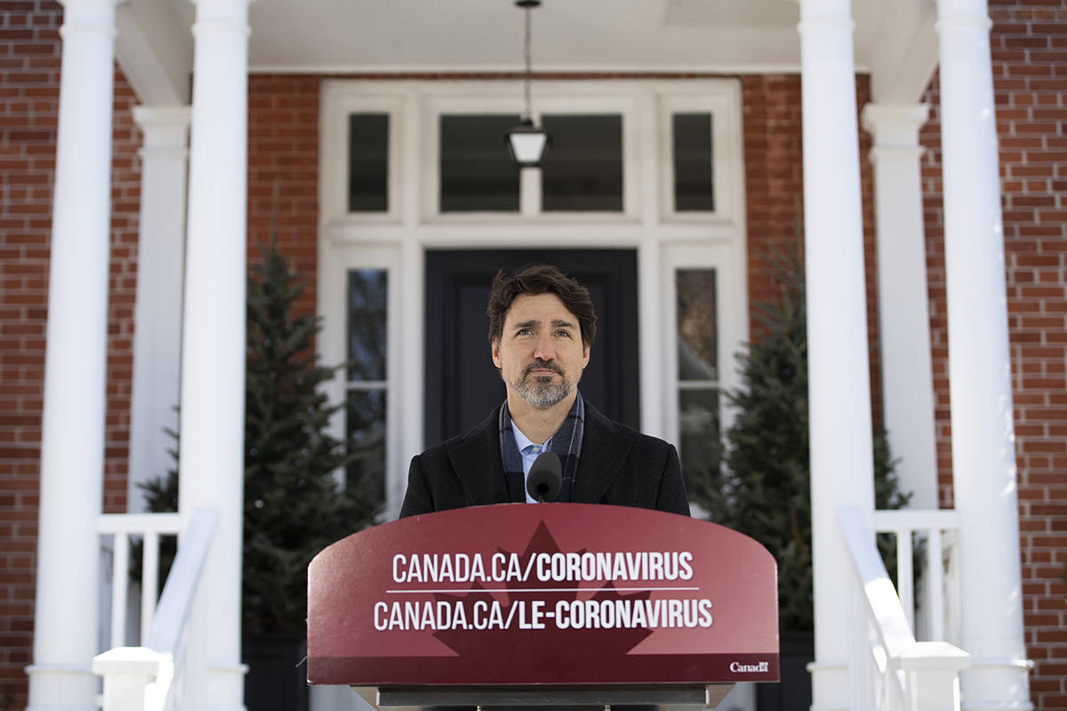 FILE – Prime Minister Justin Trudeau speaks at one of the first press conference about COVID-19 in front of his residence at Rideau Cottage on the grounds of Rideau Hall in Ottawa, on Sunday, March 22, 2020. THE CANADIAN PRESS/Justin Tang