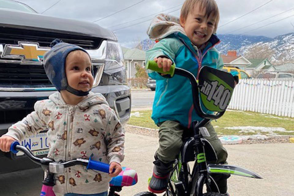 Kids, ages two and four, are all smiles after receiving new bikes from total strangers. Their bikes were stolen on New Year’s Day when out for a walk near Penticton Ave. By the next day, strangers donated to replace the bikes. (Dawn Jones Facebook)