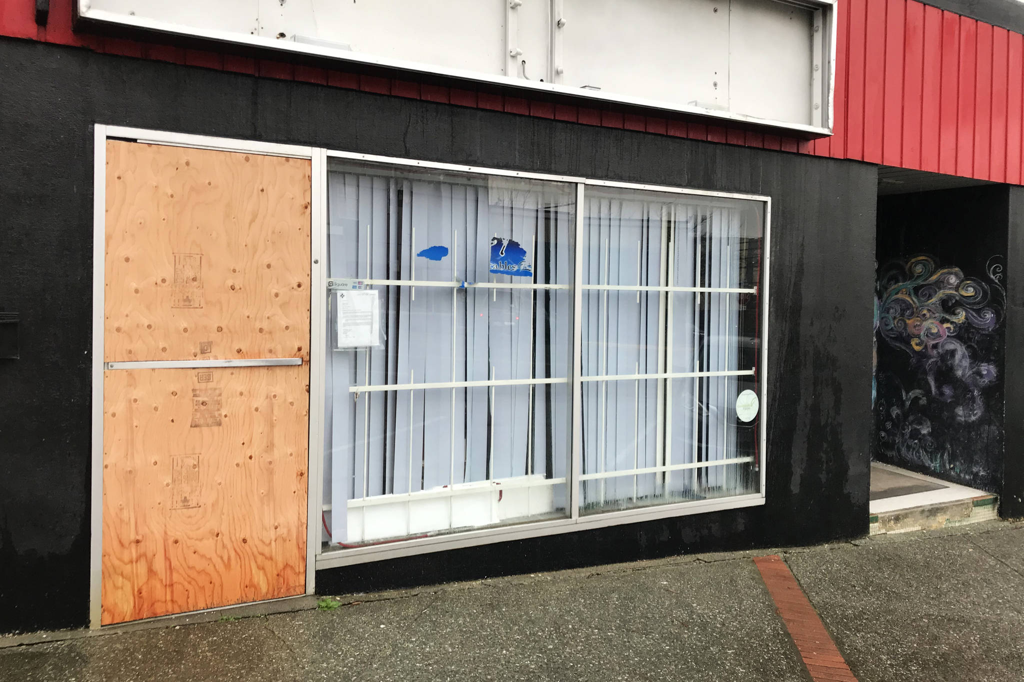 A former tattoo shop on Third Avenue is boarded up after the Port Alberni Fire Department ordered the building to be vacated due to unsafe conditions. (ELENA RARDON / ALBERNI VALLEY NEWS)