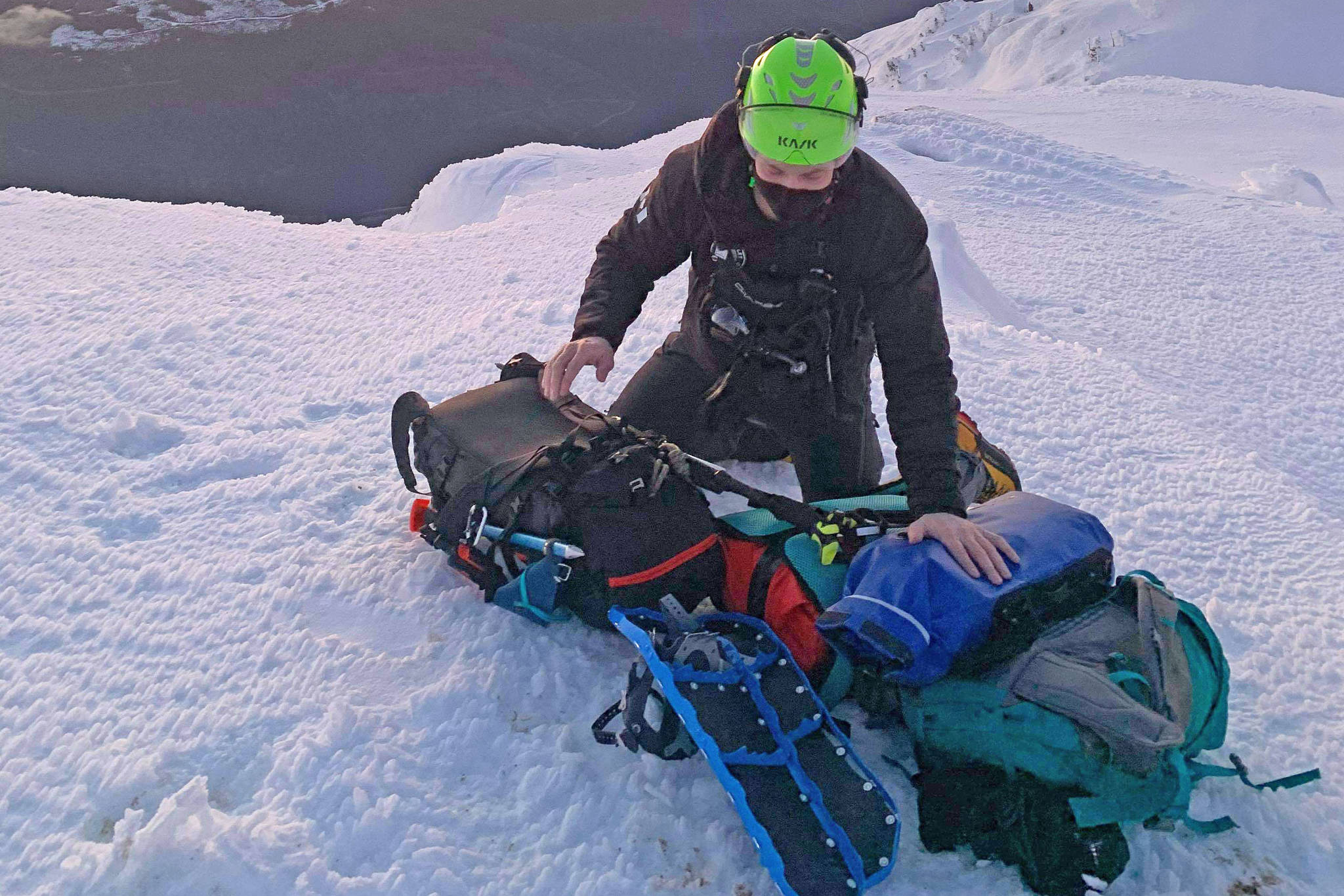 Alberni Valley Rescue Squad volunteer Nick Bachmeier prepares his gear to descend Judge’s Route on Mount Arrowsmith to rescue three hikers, two seriously injured, on Sunday, Jan. 17, 2021. (PHOTO COURTESY DAVE POULSEN, AVRS)