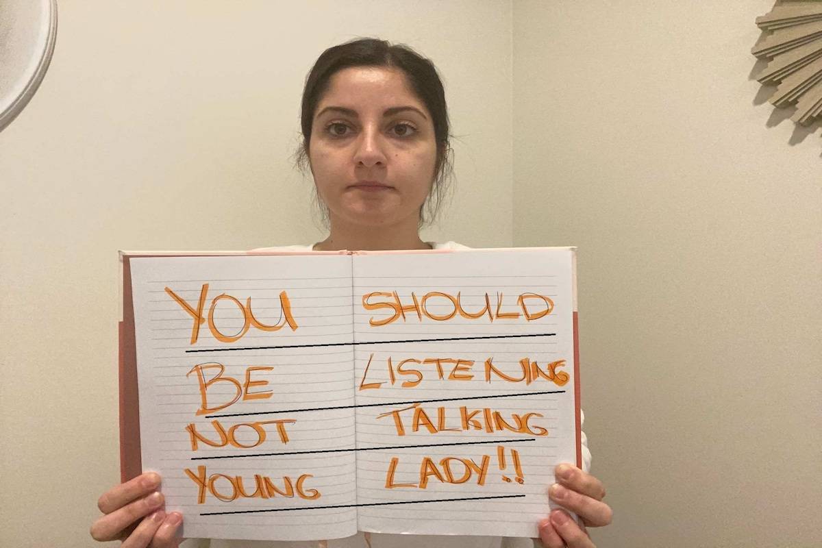 Aquaculture employee from Vancouver Island, Michelle, poses with a comment that she received on social media. Facebook group Women in Canadian Salmon Farming started an online campaign #enoughisenough to highlight the harassment they were facing online after debates about Discovery Islands fish farms intensified on social media. (Submitted photo)
