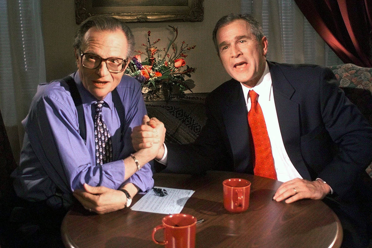 FILE - In this Dec. 16, 1999 file photo, Republican presidential candidate Texas Gov. George W. Bush jokes with CNN’s Larry King after finishing the “Larry King Live” show from the Wildhorse Saloon in Nashville, Tenn. King, who interviewed presidents, movie stars and ordinary Joes during a half-century in broadcasting, has died at age 87. Ora Media, the studio and network he co-founded, tweeted that King died Saturday, Jan. 23, 2021 morning at Cedars-Sinai Medical Center in Los Angeles. (AP Photo/John Russell, file)