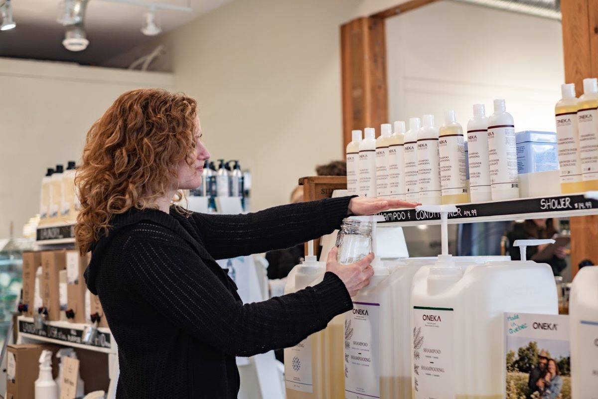 Ginette Matthews shows off some of the wares at The Local Refillery. Photo by Femke Overmaat