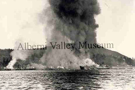 The 10,000-ton freighter S.S. Sampep can be seen burning in the Alberni Inlet in front of the assembly wharf fire of Aug. 28, 1947. Port Alberni’s waterfront has constantly changed thanks to fire (among other reasons) in the last 100 years. (PHOTO PN05146 COURTESY ALBERNI VALLEY MUSEUM)
