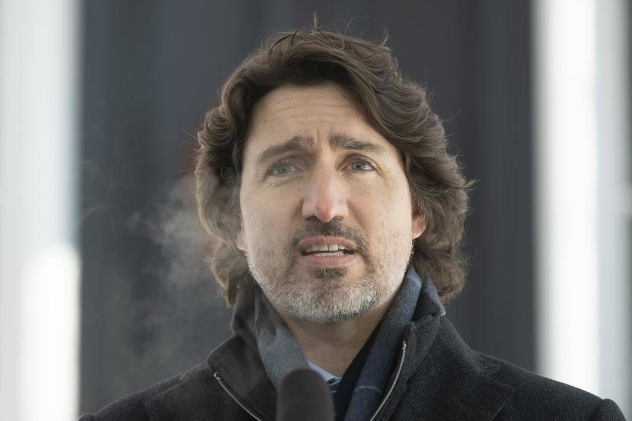Prime Minister Justin Trudeau speaks outside Rideau Cottage on Tuesday, Feb. 9, 2021. Trudeau says the federal government will provide nearly $15 billion for public-transit projects across the country. THE CANADIAN PRESS/Adrian Wyld