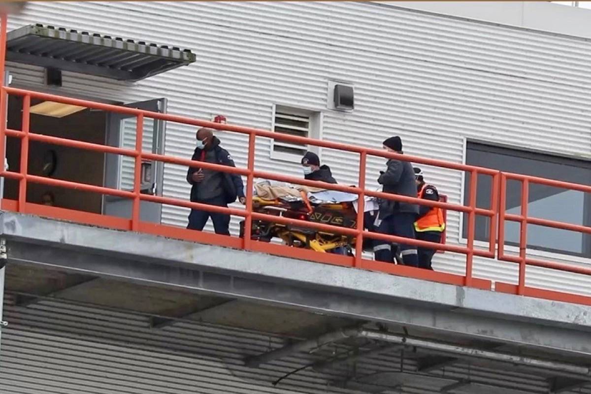 B.C. Ambulance Services prepare to send a patient to Royal Columbian Hospital via air ambulance following a fatal crash on the Coquihalla Highway. More than 40 people were transported to Hope Secondary, set up a s a warming station. One person has died and three are seriously injured. (Photo/Shane MacKichan)