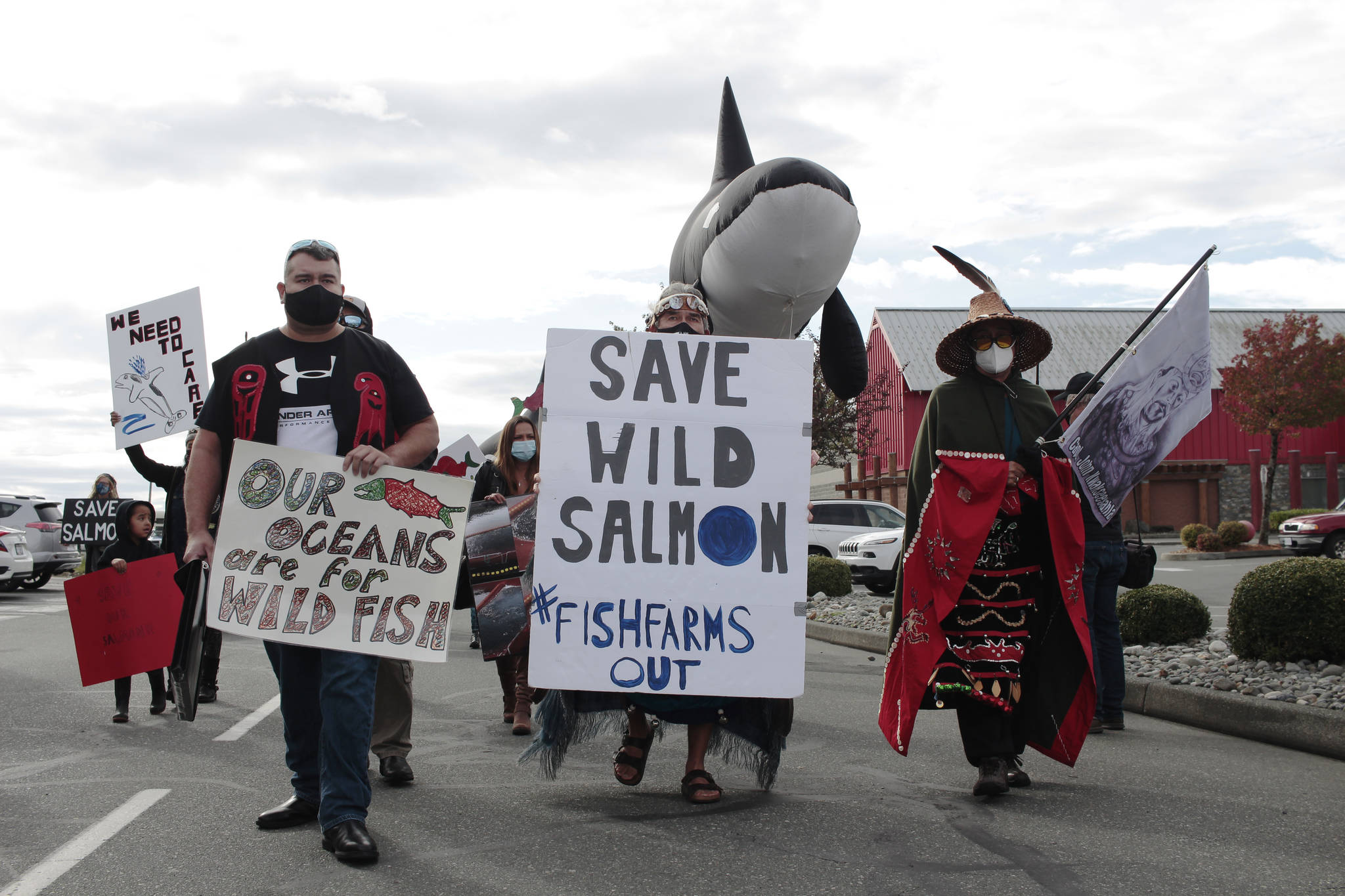 A Photo from Sept. 2020, when First Nations and wild salmon advocates took to the streets in Campbell River to protest against open-pen fish farms in B.C.’s waters. On Dec. 17, federal fisheries minister Bernadette Jordan announced her decision to phase out 19 fish farms from Discovery Islands. (Marc Kitteringham/Campbell River Mirror)