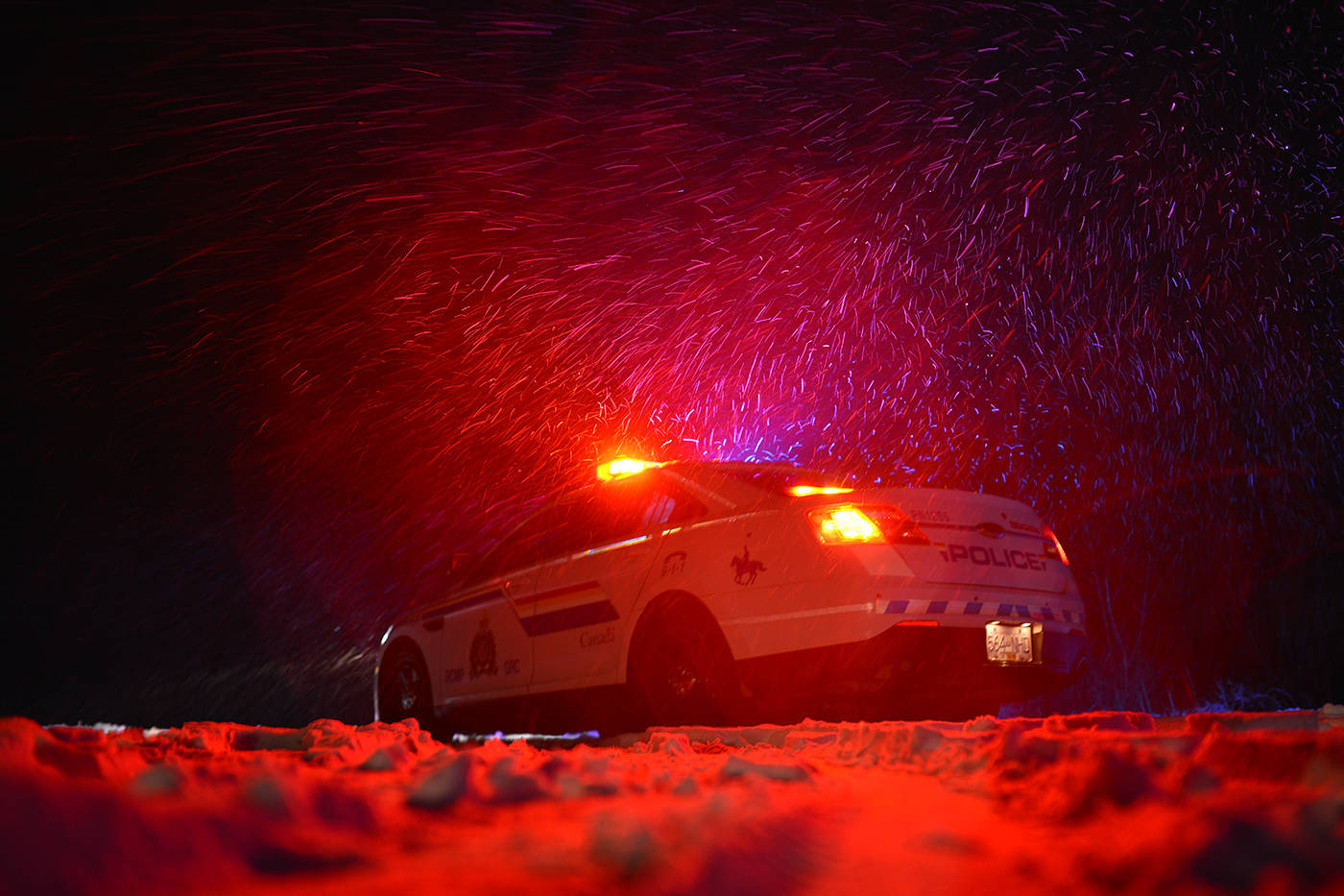 RCMP pictured at a motor vehicle incident during snowy conditions. (Phil McLachlan - Black Press Media)