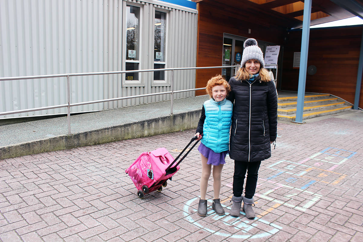 Ella Donovan with mom Tina outside Fuller Lake Arena before heading onto the ice for practice. (Photo by Don Bodger)
