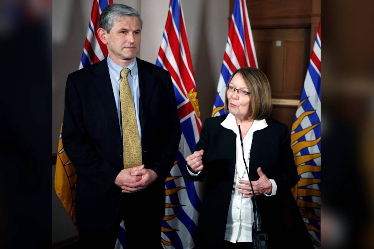 Then-Liberal leader Andrew Wilkinson looks on as MLA Shirley Bond answers questions during a press conference at Legislature in Victoria. (Chad Hipolito / THE CANADIAN PRESS)