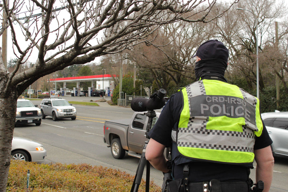 Const. Mat Jones of the CRD Integrated Road Safety Unit joined a team of Saanich police officers and ICBC representatives cracking down on distracted driving at the McKenzie/Quadra intersection in Saanich on March 3. (Devon Bidal/News Staff)