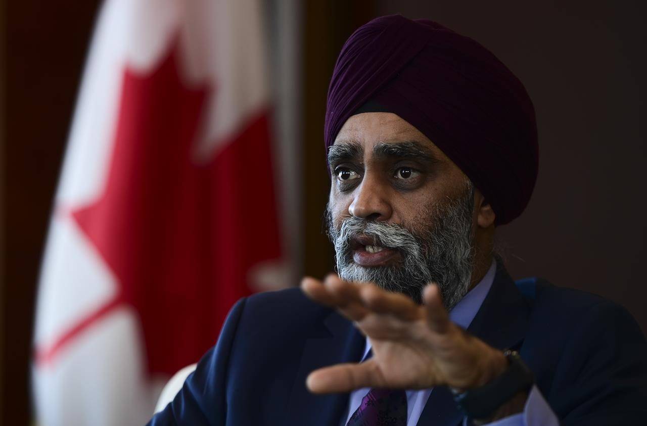 Minister of National Defence Harjit Sajjan takes part in a year-end interview with The Canadian Press at National Defence Headquarters in Ottawa on Thursday, Dec. 17, 2020. THE CANADIAN PRESS/Sean Kilpatrick