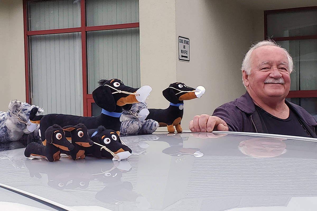 Retired SD62 custodian Jim Black brought his ‘pack’ of BARK ambassadors to a drive-thru for David Cameron Elementary School students during the early months of the COVID-19 pandemic. Black championed the BARK program, which encouraged students to keep their school and homes clean. (Courtesy of David Cameron Elementary)