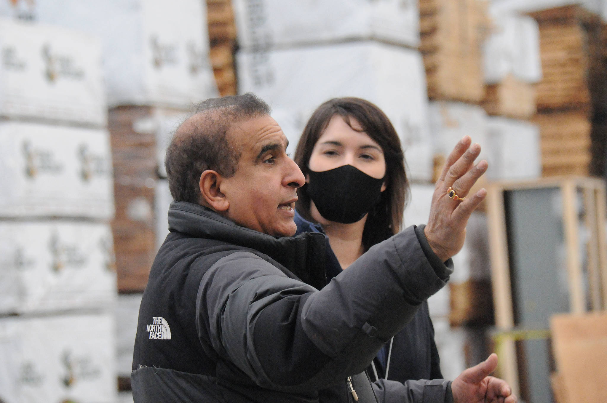 Port Alberni mayor Sharie Minions listens as San Group owner Kamal Sanghera explains the chop line inside one of the buildings at San’s remanufacturing plant on Stamp Avenue in Port Alberni. (SUSAN QUINN/ Alberni Valley News)