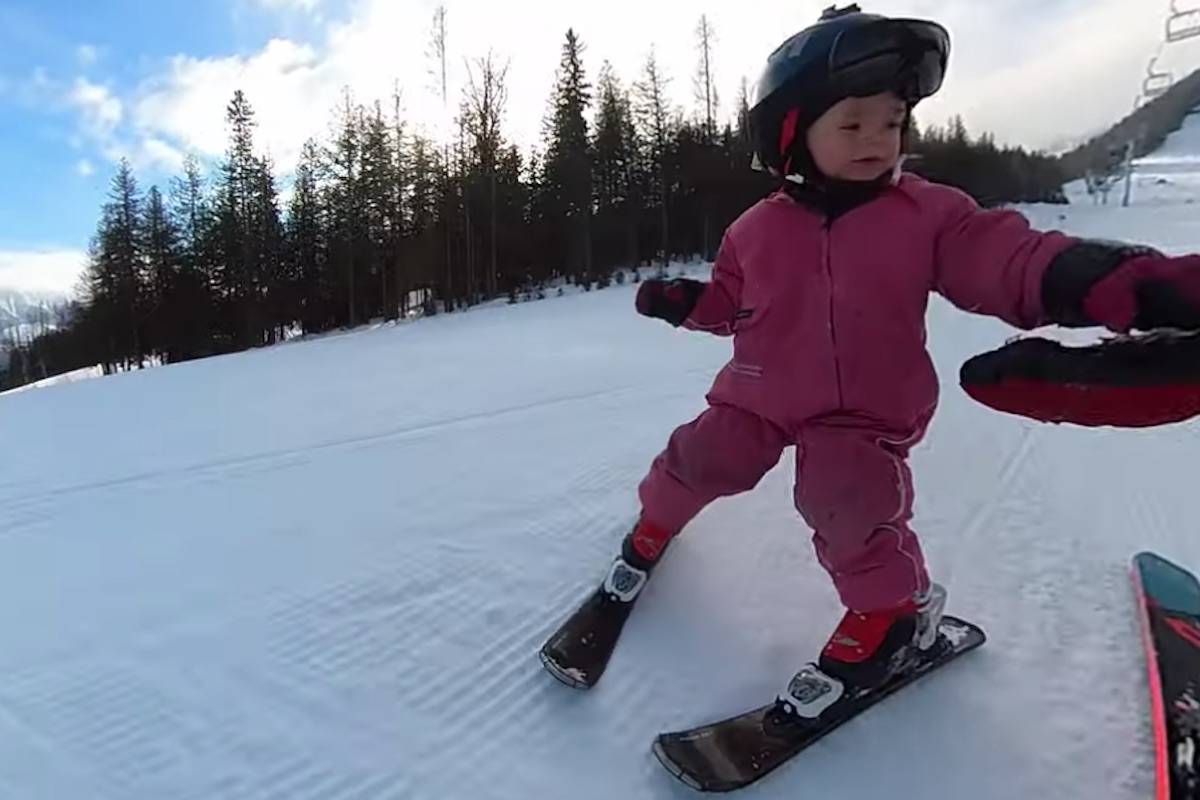 Three-year-old Adia Leidums gives her dad a hi-five at Fernie Alpine Resort. (Image courtesy of Erich Leidums)