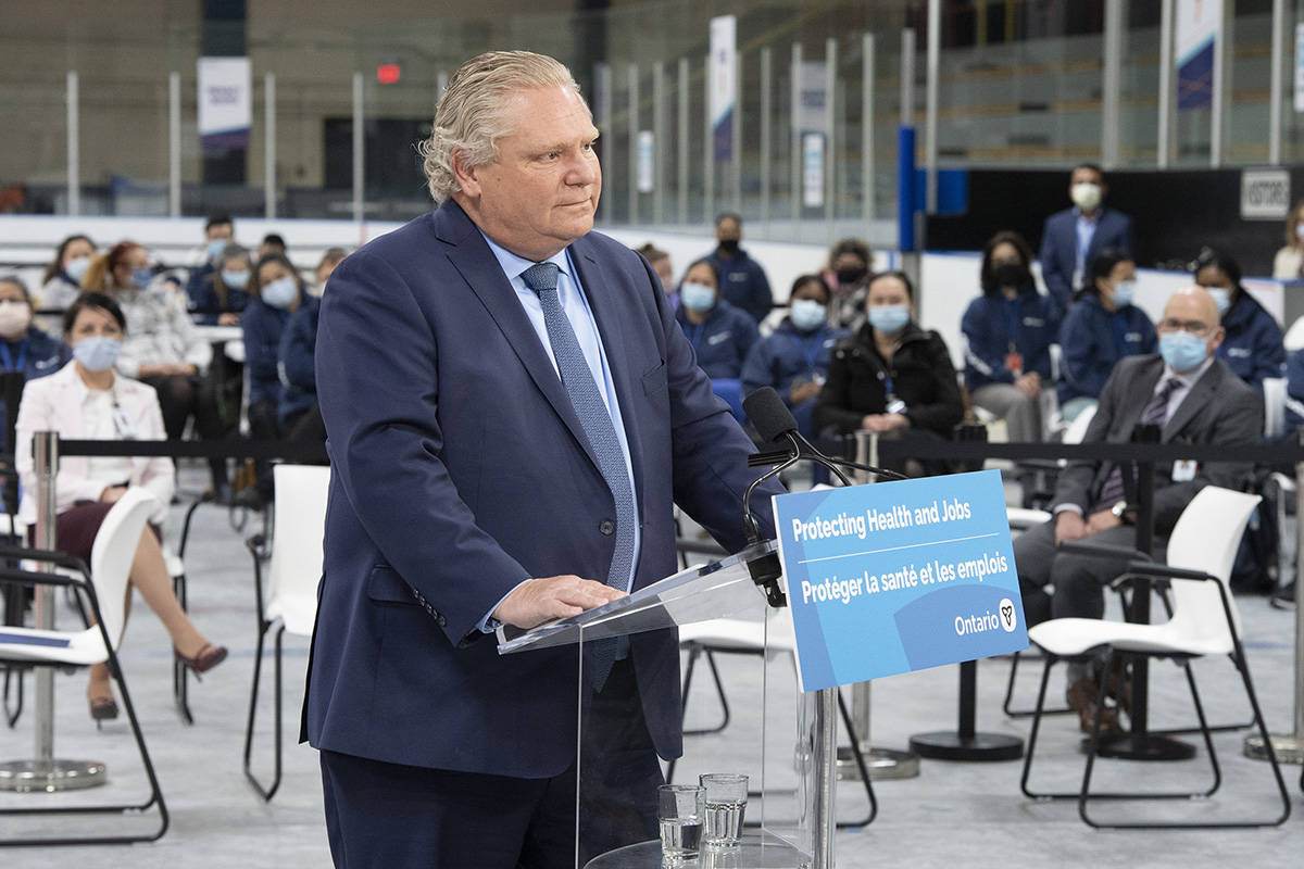 Ontario Premier Doug Ford listens to a question during the daily briefing at a mass vaccination centre in Toronto on Tuesday, March 30, 2021. THE CANADIAN PRESS/Frank Gunn