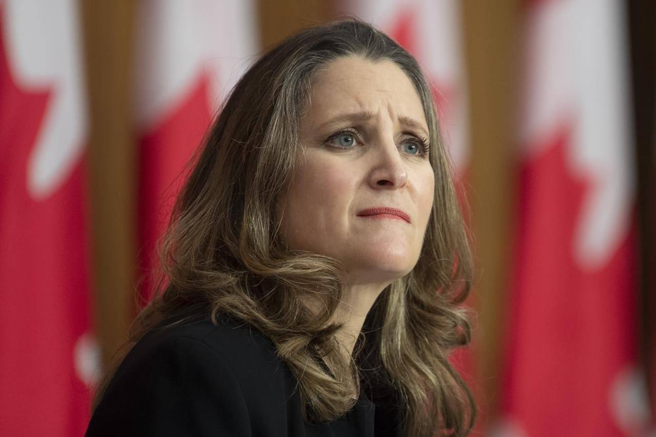 Deputy Prime Minister and Minister of Finance Chrystia Freeland listens to a question from a reporter on the phone during a news conference in Ottawa, Monday November 30, 2020. THE CANADIAN PRESS/Adrian Wyld