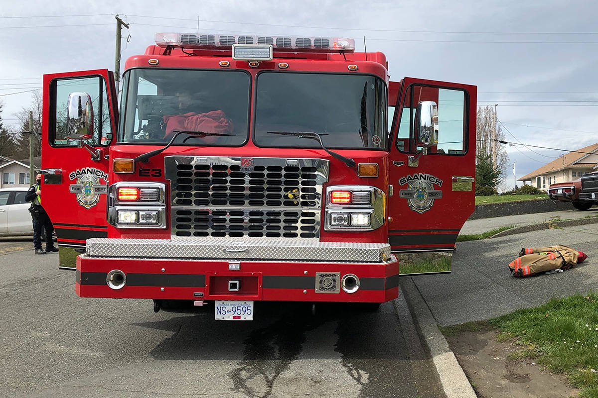 Saanich fire crews on the scene of a structure fire in the 600-block Jolly Place the morning of April 1. (Devon Bidal/News Staff)