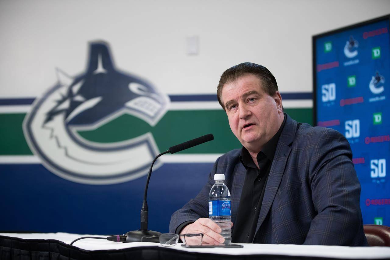 Vancouver Canucks general manager Jim Benning says the players who’ve tested positive for COVID-19 are recovering and the team still intends to play a 56-game season. THE CANADIAN PRESS/Darryl Dyck