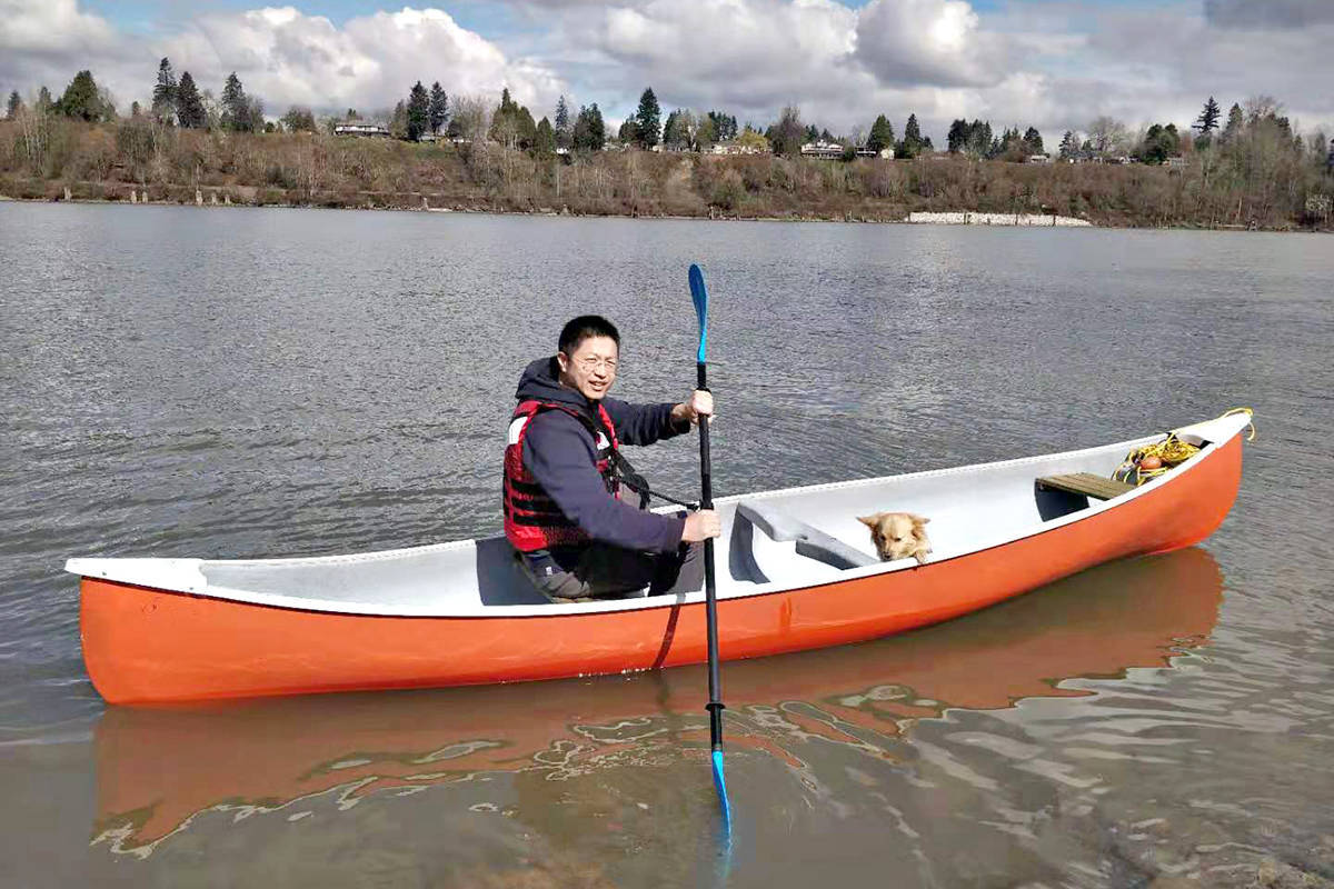 Ruming Jiang and his dog Chiu Chiu are doing fine following a brush with hypothermia that saw several people work together to get them out of the Fraser River near Langley’s Derby Reach Park on March 25, 2021 (Special to the Advance Times)