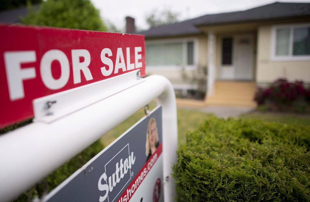 A real estate sign is pictured in Vancouver, B.C. THE CANADIAN PRESS Jonathan Hayward
