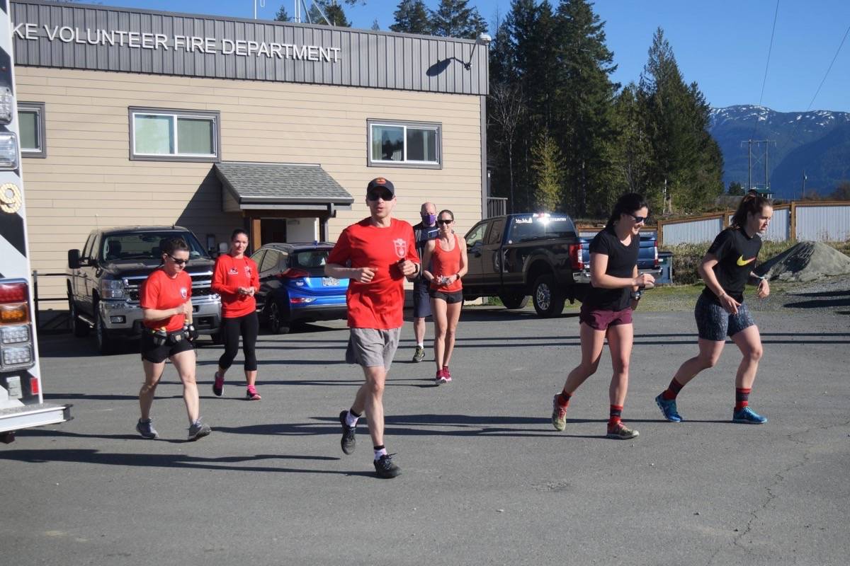 Wounded Warriors runners depart from the Sproat Lake Volunteer Fire Department hall on Hwy. 4 during a charity run on April 17. (ELENA RARDON / ALBERNI VALLEY NEWS)