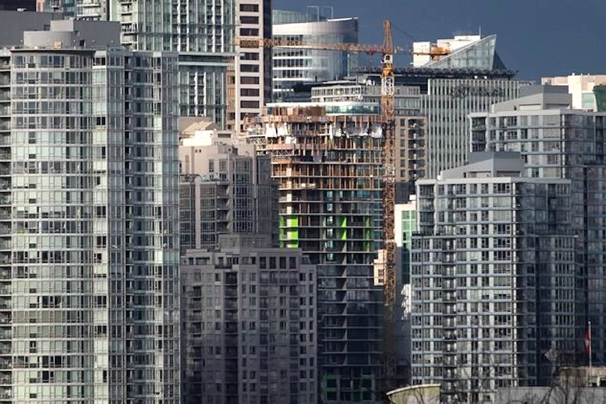 A condo tower under construction is pictured in downtown Vancouver on February 9, 2020. Experts and advocates say budget measures aimed at putting housing within reach of more Canadians mark a step in the right direction, despite a few ham-fisted moves. THE CANADIAN PRESS/Darryl Dyck