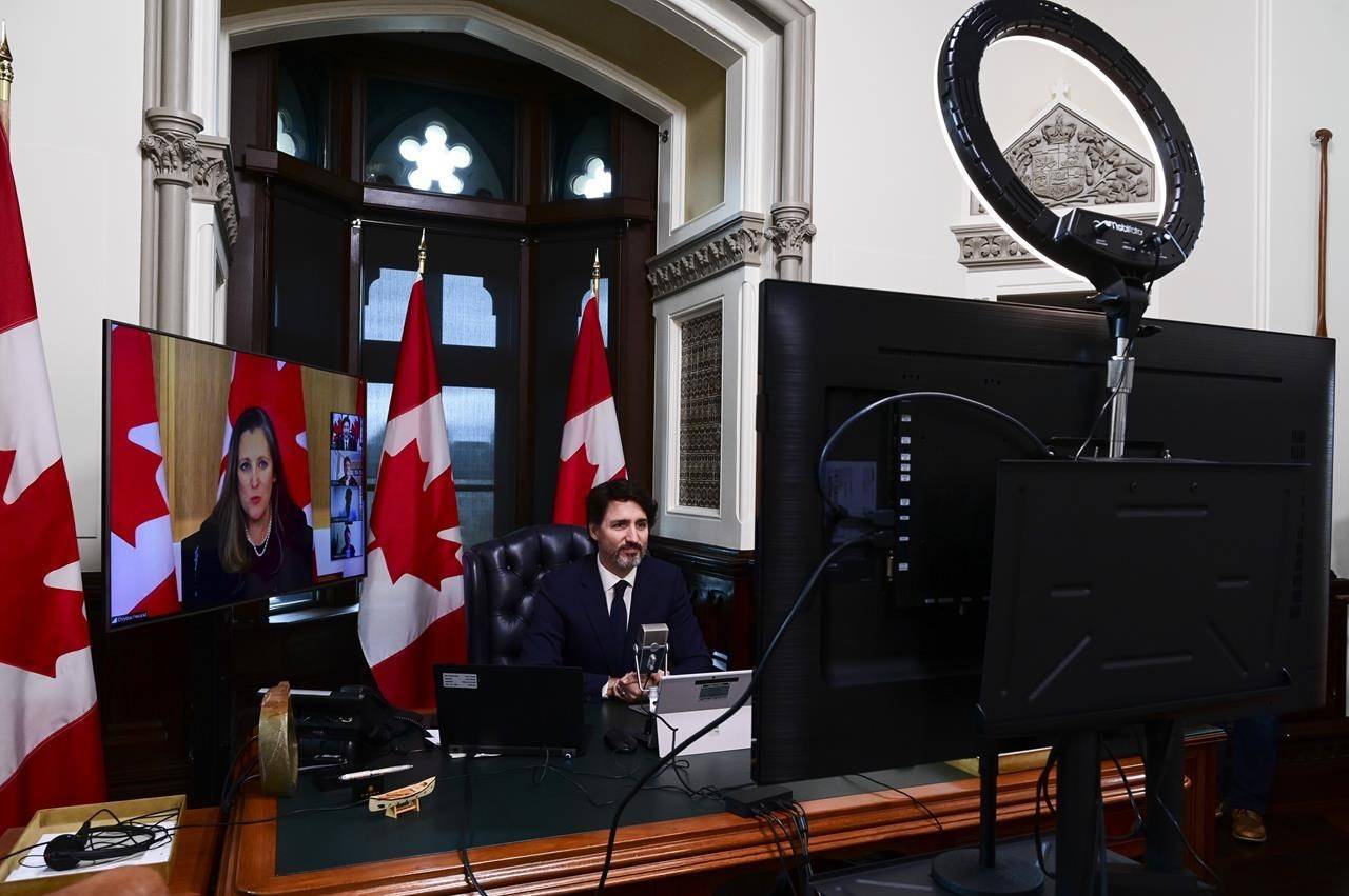 Prime Minister Justin Trudeau is joined virtually by Minister of Finance Chrystia Freeland as they talk online to a group of front-line pharmacists from across the country to discuss the ongoing vaccination efforts in the fight against COVID‑19, from the Prime Ministers office on Parliament Hill in Ottawa on Tuesday, April 20, 2021. THE CANADIAN PRESS/Sean Kilpatrick