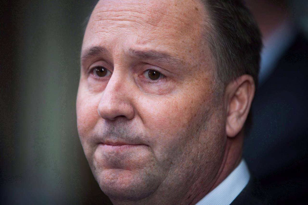 Then-B.C. Education Minister Mike Bernier pauses while answering questions during a news conference in Vancouver, B.C., Thursday, Jan. 14, 2016. Bernier, a Liberal legislator in British Columbia, says he and his family have tested positive for COVID-19. THE CANADIAN PRESS/Darryl Dyck