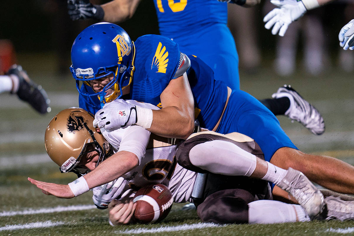 Former Vernon Panthers football standout Ben Hladik of the UBC Thunderbirds (top, in a game against the Manitoba Bisons, <ins>making one of his 38 Canada West solo tackles in 2019</ins>), was chosen in Tuesday’s 2021 Canadian Football League draft. (Rich Lam - UBC Thunderbirds photo)