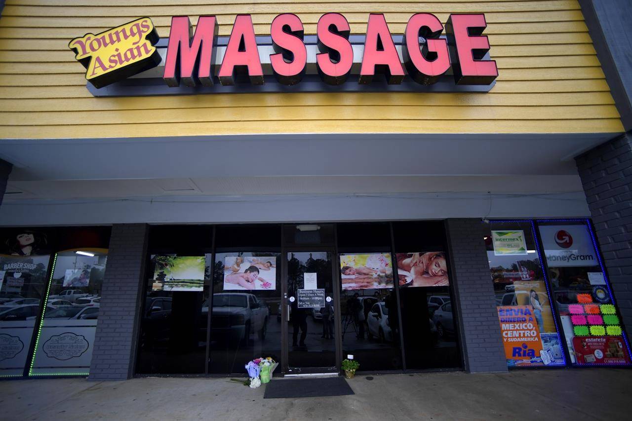 A make-shift memorial is seen outside a business where a multiple fatal shooting occurred in Acworth, Ga. Robert Aaron Long, 22, accused of killing eight people, six of them women of Asian descent. (AP Photo/Mike Stewart)