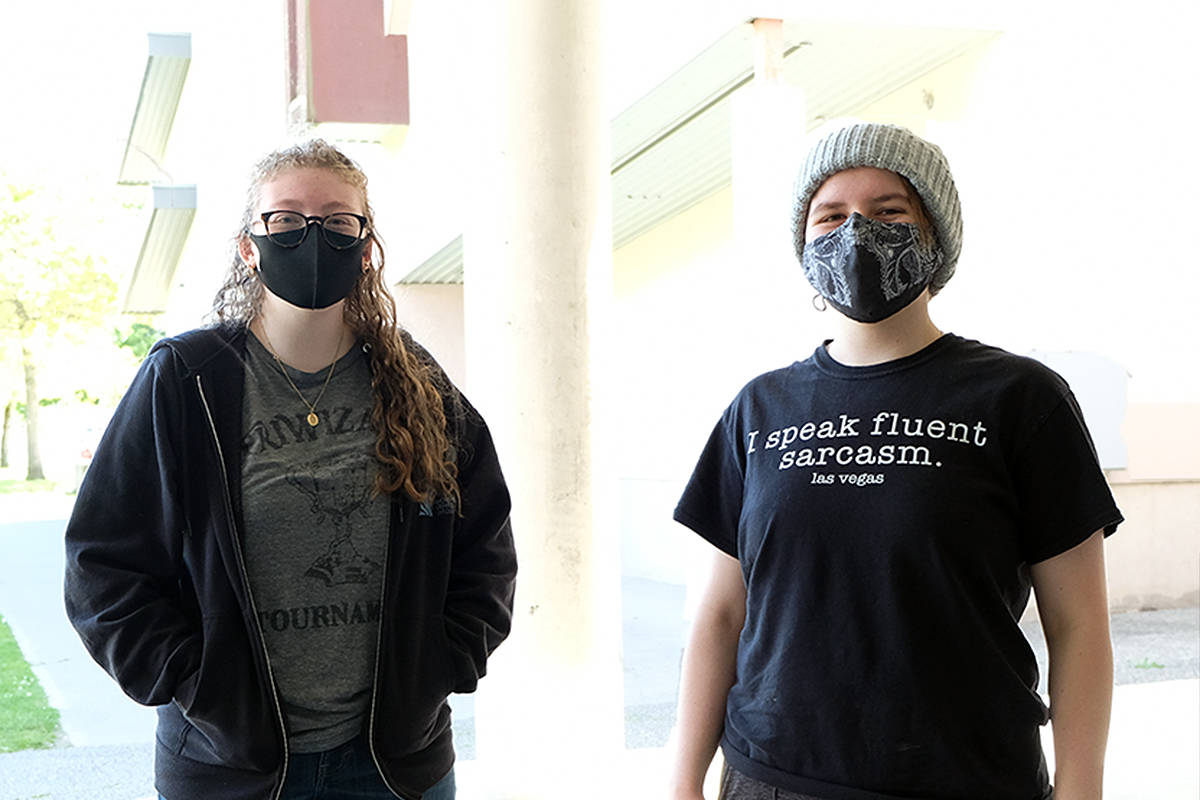 Adryanna Ralphs, left, and valedictorian Alyssa Taylor graduate from Edward Milne Community School in Sooke this year, in a weird, different, kiboshed and subdued kind of way. (Zoe Ducklow - Sooke News Mirror)