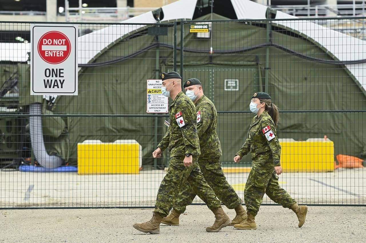 Military health-care personnel are on site at a mobile health unit at Sunnybrook Hospital during the COVID-19 pandemic in Toronto on Friday, April 30, 2021. The Department of National Defence says Canadian military personnel are coming forward in droves to be vaccinated, with more than 85 per cent of all troops have received at least one dose. THE CANADIAN PRESS/Nathan Denette