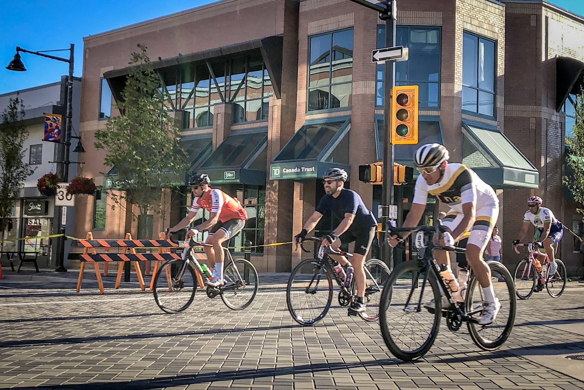 Granfondo rider Lorne Paperny and other participants stream over the cobblestone streets in downton Penticton during the Granfondo Axel Merckx Okanagan cycling event. Do you know where cyclist Axel Merckx was born? (Black Press file photo)