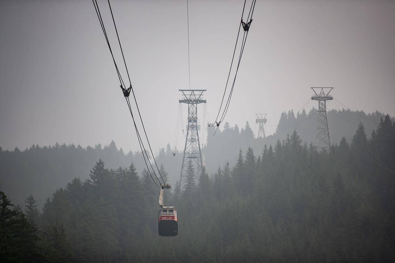 Smoke from wildfires burning in the U.S. fills the air as the Grouse Mountain tram transports people down the mountain, in North Vancouver, B.C,, on Saturday, September 12, 2020. The World Air Quality Index, a non-profit that tracks air quality from monitoring stations around the world, rated Vancouver’s air quality as the second worst in the world Saturday. Environment Canada has issued a special air quality statement for Metro Vancouver, showing a very high risk to health due to wildfire smoke from Washington and Oregon. THE CANADIAN PRESS/Darryl Dyck