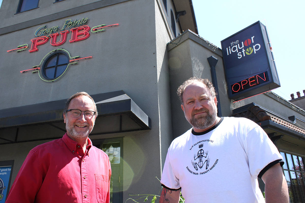 Gorge Pointe Pub owners Tom Burley, left, and Mike Joss outside the Esquimalt pub. (Jake Romphf/ News Staff)