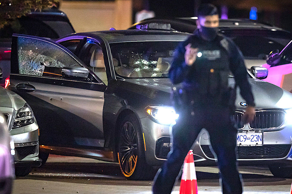 Bullet holes are seen in the windshield and door of a vehicle after Brothers Keepers member Jaskeert Kalkat, 23, was killed during a shooting in Burnaby on May 13, 2021. THE CANADIAN PRESS/Darryl Dyck